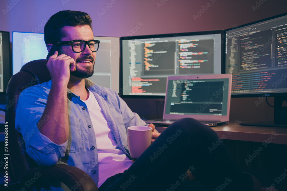 Poster portrait of his he nice attractive cheerful cheery brunet guy geek talking on phone remote support e