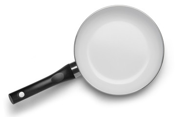 Black pan with white ceramic coating on a white background. Top view