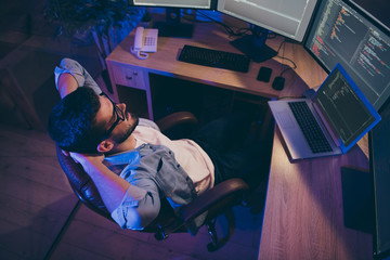 Above high angle view portrait of his he nice attractive skilled guy top company manager providing remote help assistance ip address connection in dark room work place station