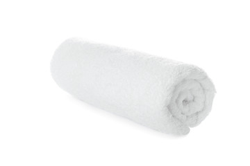 Fototapeta na wymiar Rolled soft terry towel on white background