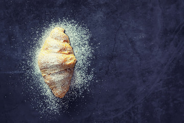 Naklejka premium Fresh pastries on the table. French flavored croissant.