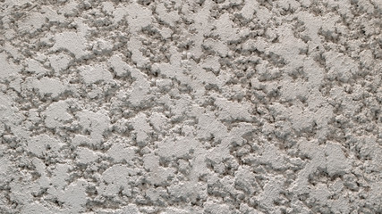 The walls of the white house have beautiful cracks and can be used as a background.