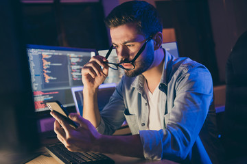 Photo of it-specialist work late at night sit office chair read telephone team email solve problem...
