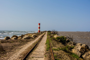 Train tracks between river and ocean