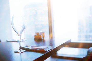 Cocktail glasses on the windowsill by the glass