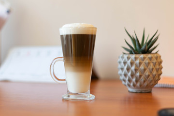 cup of coffee of wooden table