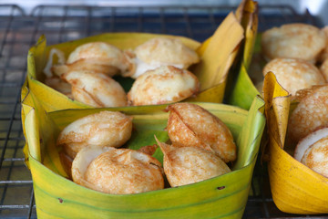 Kind of Thai sweetmeat Thai style snack with banana leaf warm from hot plate delicious street food with coconut milk