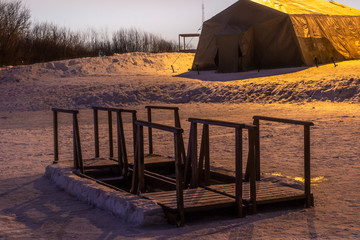 prepared hole for swimming on the feast of the baptism of Jesus Christ frosty night