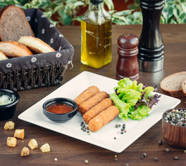 cheese crockets with barbecue sauce