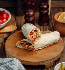 chicken doner in lavash on wooden board