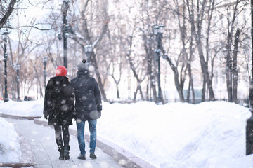 Young couple walking through the winter