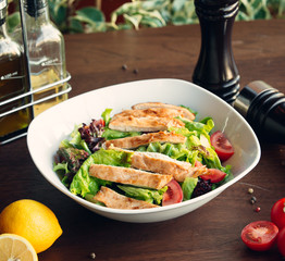 chicken salad with vegetables on the table