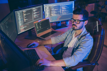 Portrait of his he nice attractive focused brunette guy creating script coding java html mysql...