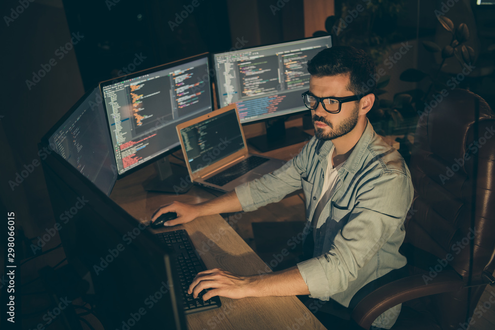 Poster profile side view of nice attractive serious smart clever bearded brunet guy sitting in chair editin