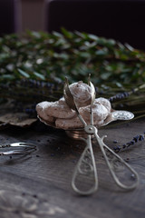 sweet dessert, meringue in a silver vase with greenery. shallow depth of field