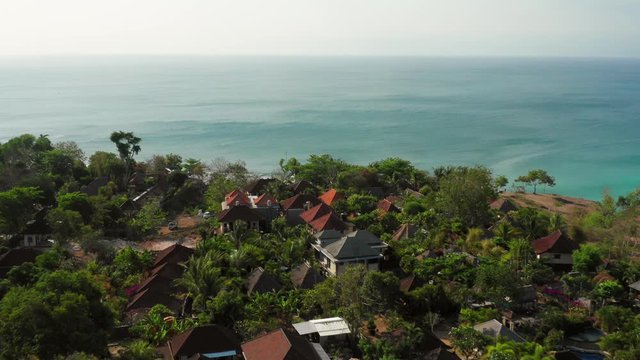 The town of Bingin at the cliffs of Uluwatu during low tide. Aerial shot.
