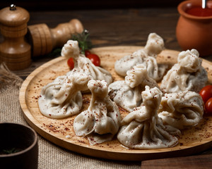 georgian khinkali on wooden board