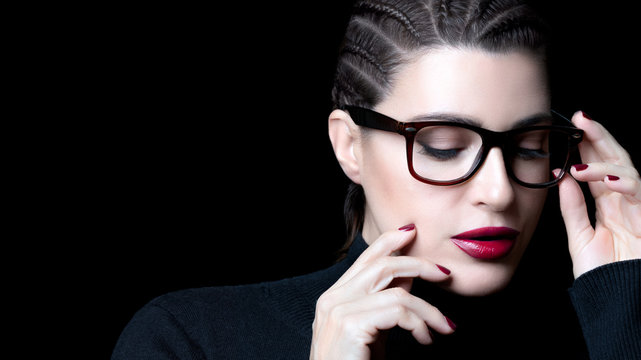 Stylish woman with trendy glasses and perfect makeup