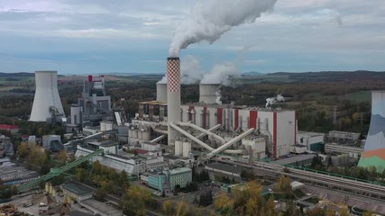Aerial view of huge coal thermal power plant, steaming chimney and cooling towers - landscape panorama of Poland from above, Europe