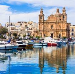 Landmarks of Malta - Msida cathedral and marina with the sail boats