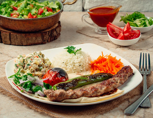 lule kebab with rice and vegetables