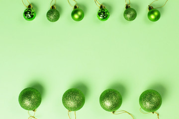 New Year background with christmas decorations on green.