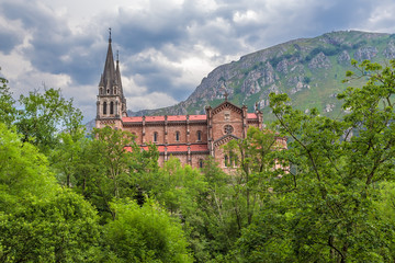 Covadonga, Spain. Basilica of the Holy Virgin Mary on a background of mountains