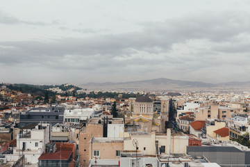 Acropolis and old city in Athens in a cloudy day