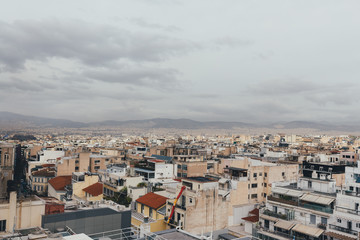 Acropolis and old city in Athens in a cloudy day