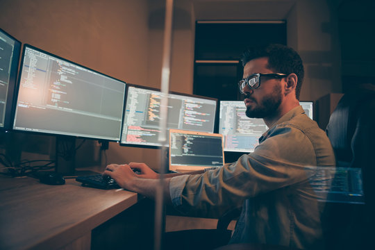 Photo of it-specialist hired serious for solving all the back-end failures occurred after restarting corporation web site working on optimization software to work using different operational systems