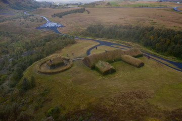 Traditional turf viking's house. Þjóðveldisbærinn Stöng. Iceland. Aerial drone shot. September 2019