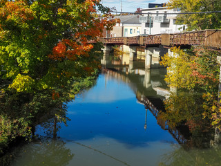 river in fall with boardwalk