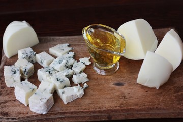 Blue mold cheese with honey on the table 