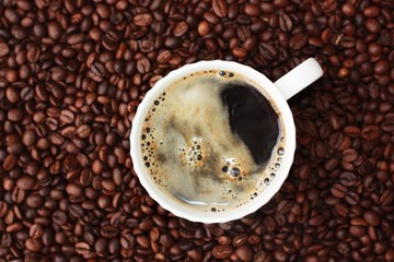 Coffee beans and coffee Americano on the table