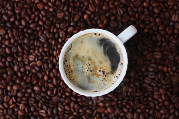 Coffee beans and coffee Americano on the table