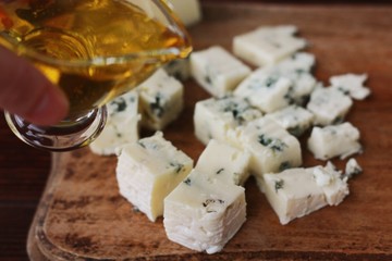 Blue mold cheese with honey on the table 