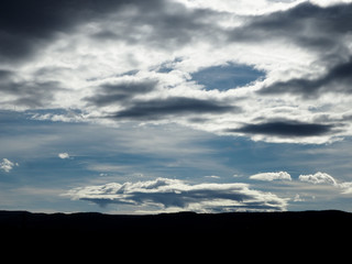 Landscape cloudy sky and silhouette of hills