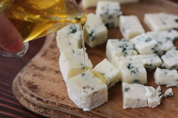Blue mold cheese with honey on the table 