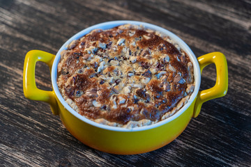 Homemade organic currant pie with walnut, dessert ready to eat. Currant tart on the old wooden background, closeup