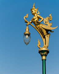 Fototapeta na wymiar old thai street lamp on background of blue sky