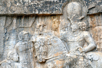 Sassanian stone reliefs in Naqsh-e Rostam (rock tombs of ancient iranian kings Darius III,...