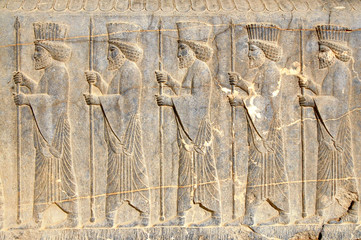 Warriars with spears. Ancient relief. Persepolis (6th-4th century BC), capital of the Achaemenid Empire (World Heritage Site since 1979), Iran.