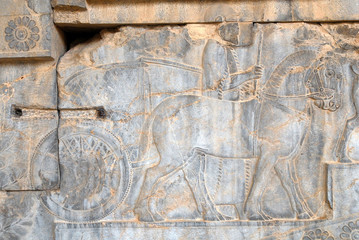 A chariot and horses. Ancient relief. Persepolis (6th-4th century BC), capital of the Achaemenid Empire (World Heritage Site since 1979), Iran.