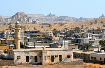 Roofs, badgirs and minarets. Fast-disappearing traditional culture of Persian Gulf. Fishing village of Laft. Qeshm Island, Iran.