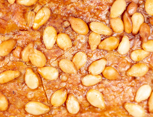 Sesame seeds on a brown crust of bread