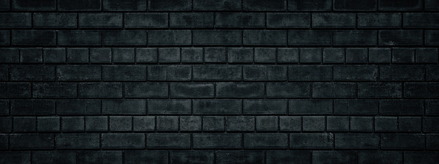 Black brick wall wide texture. Gloomy grunge panoramic dark background