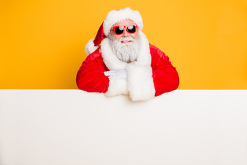 Portrait of funky funny santa claus put hands on white pure billboard advertise winter shopping...