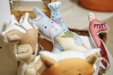 Soft cute handmade toys in wooden box