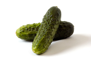 Cucumbers on the white background