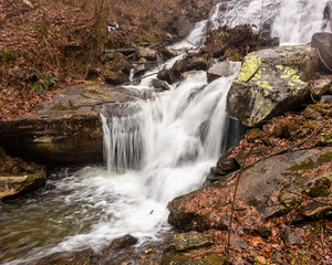 Fototapeta na wymiar Small Stream with Waterfall